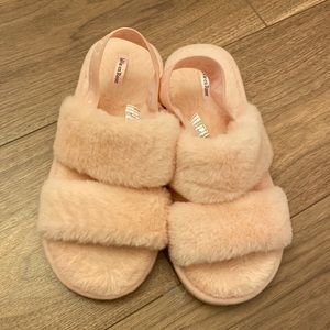 Baby pink slippers worn like once